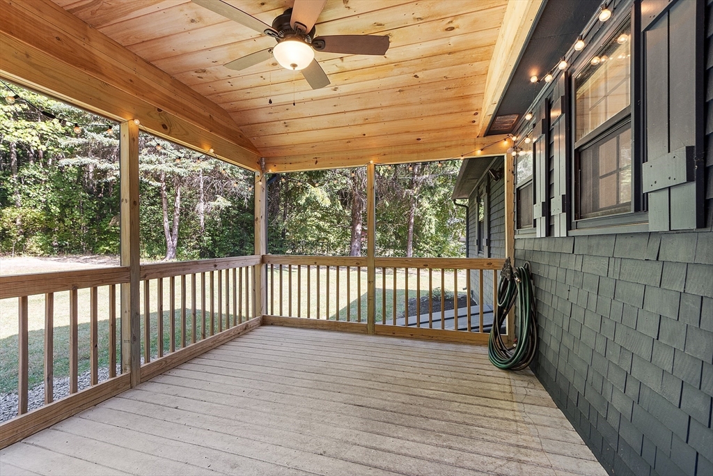 707 Sterling Road Lancaster, MA 01523 - Photo 30 of 40 a view of a porch with wooden floor