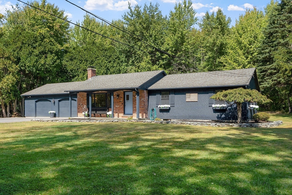 707 Sterling Road Lancaster, MA 01523 - Photo 3 of 40 a view of a house with a swimming pool