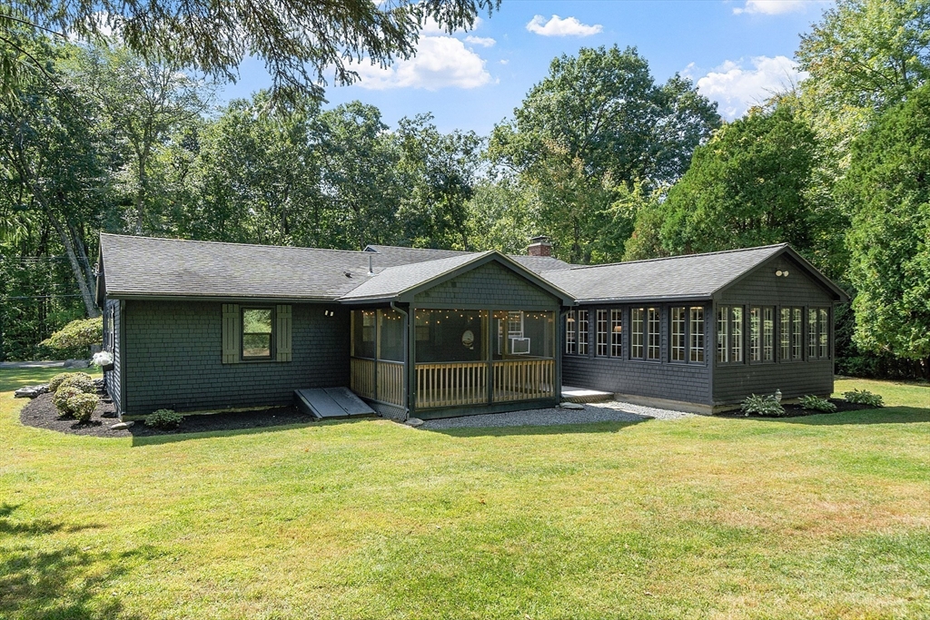707 Sterling Road Lancaster, MA 01523 - Photo 31 of 40 a front view of a house with a yard