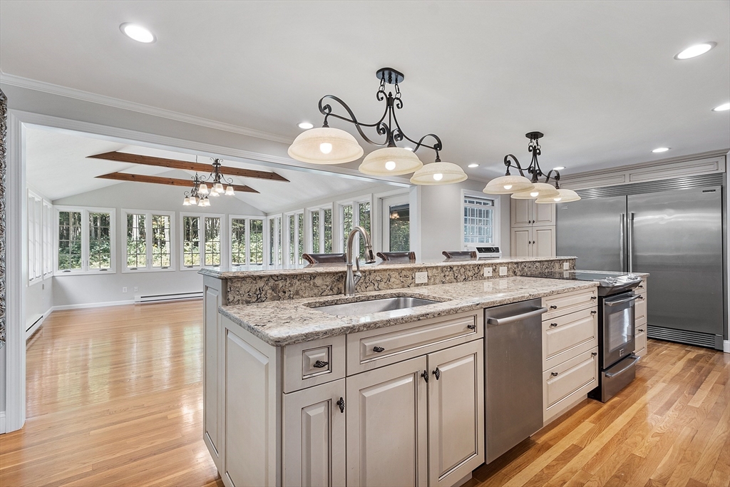 707 Sterling Road Lancaster, MA 01523 - Photo 5 of 40 a kitchen with stainless steel appliances granite countertop a sink and cabinets