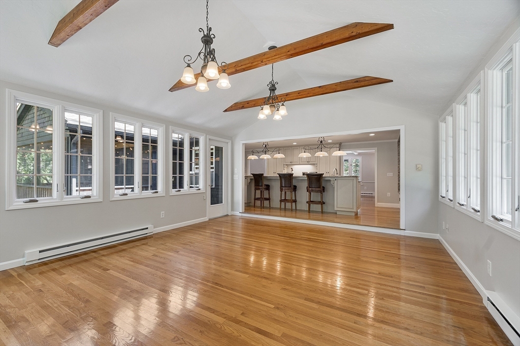 707 Sterling Road Lancaster, MA 01523 - Photo 6 of 40 a view of an empty room with wooden floor and a window