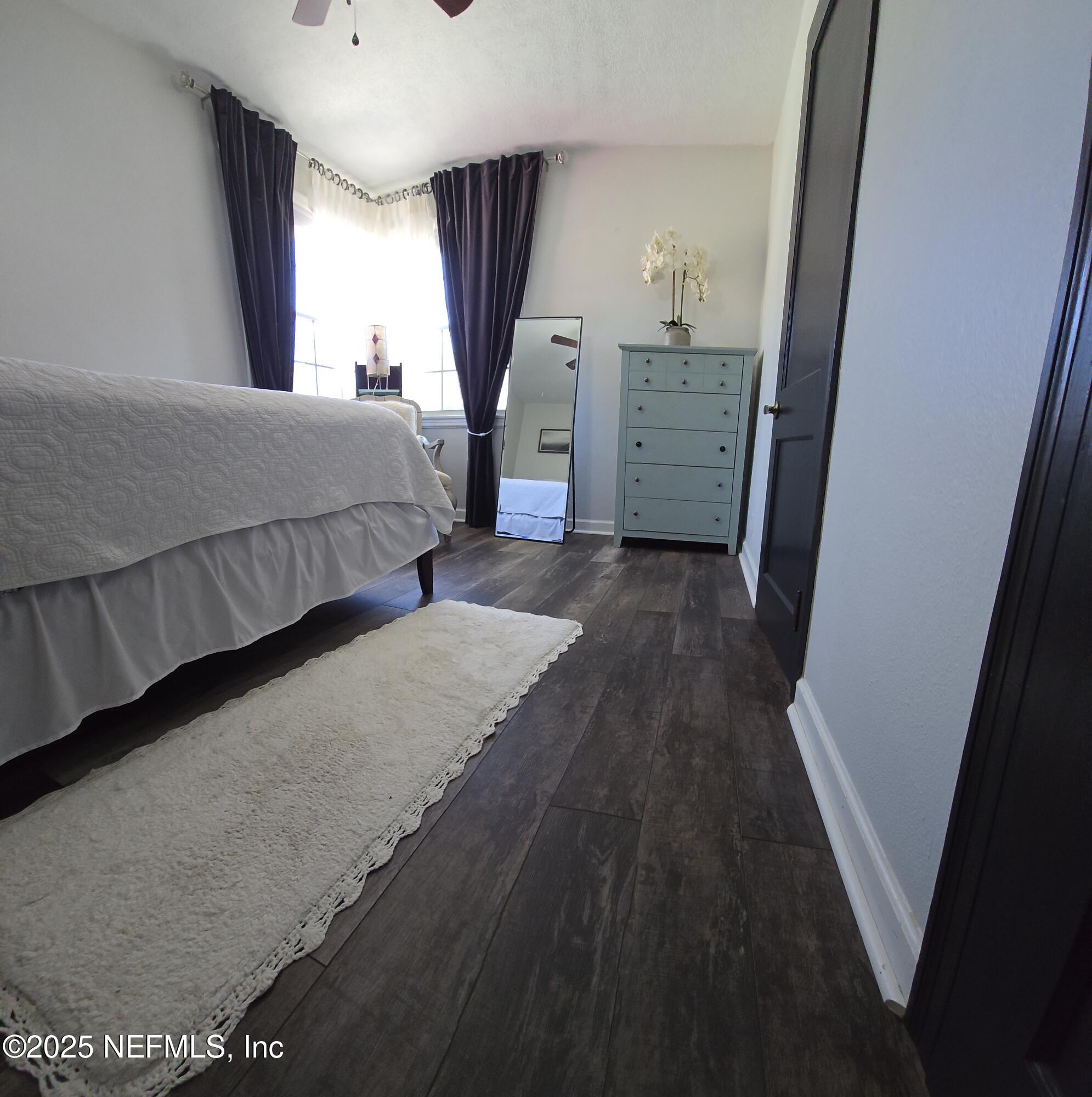 1228 Glen Laura Road Jacksonville, FL 32205 - Photo 19 of 40 a bedroom with a bed and a window