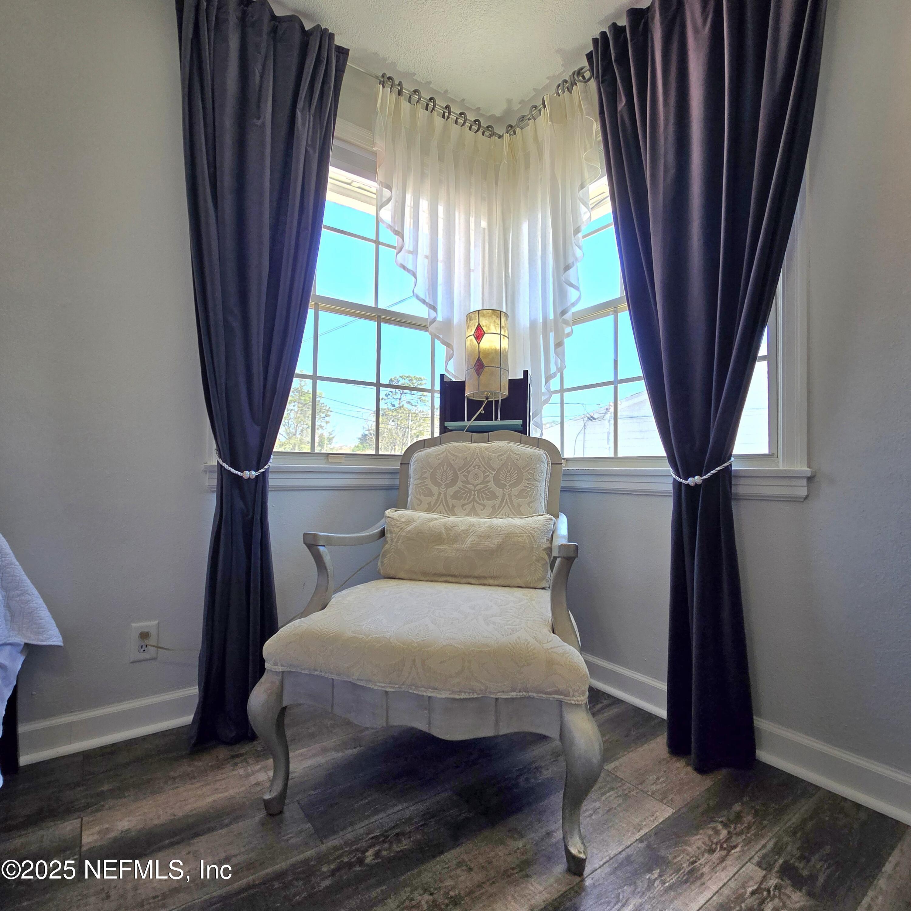 1228 Glen Laura Road Jacksonville, FL 32205 - Photo 23 of 40 a living room with furniture and a window