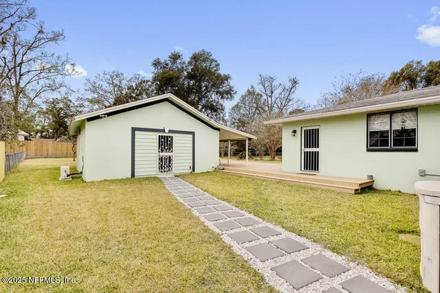 a large white house with a large pool in front of it