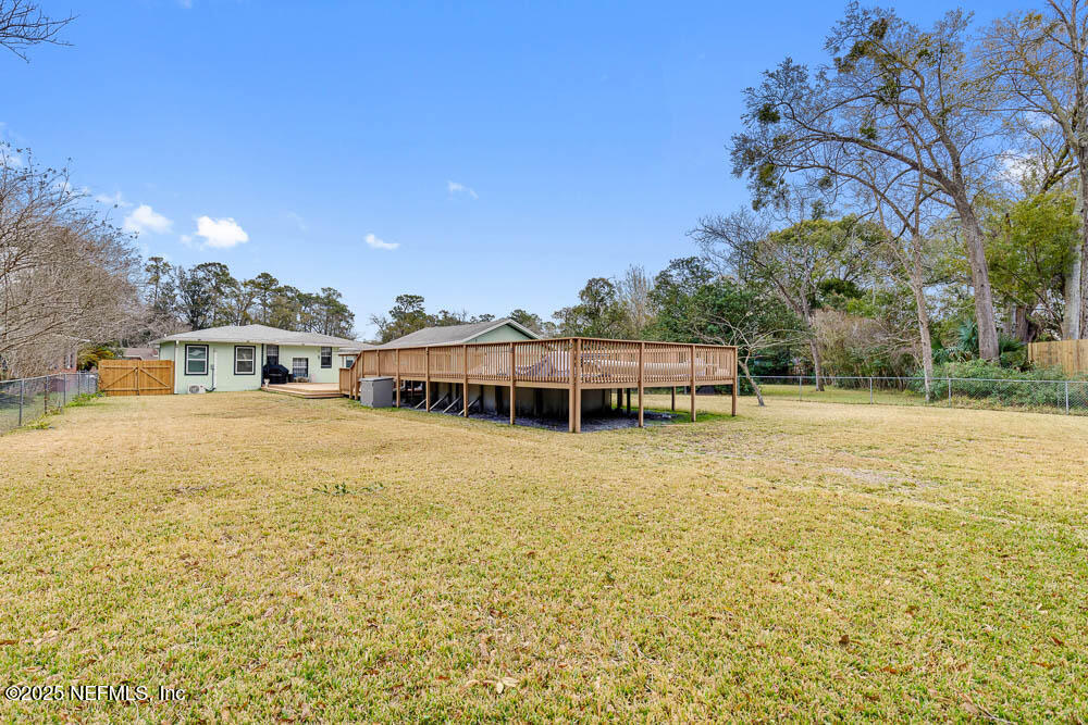 1228 Glen Laura Road Jacksonville, FL 32205 - Photo 27 of 40 a front view of a house with a garden