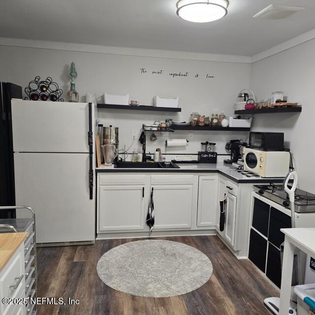 1228 Glen Laura Road Jacksonville, FL 32205 - Photo 36 of 40 a kitchen with stainless steel appliances granite countertop a refrigerator sink stove and cabinets