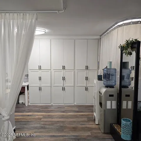 a view of entryway with wooden floor and staircase