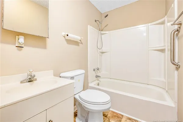 a bathroom with a sink a toilet a shower and a mirror