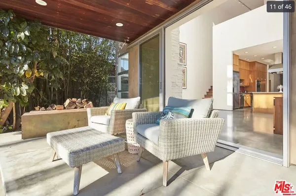 a outdoor living space with furniture and a potted plant