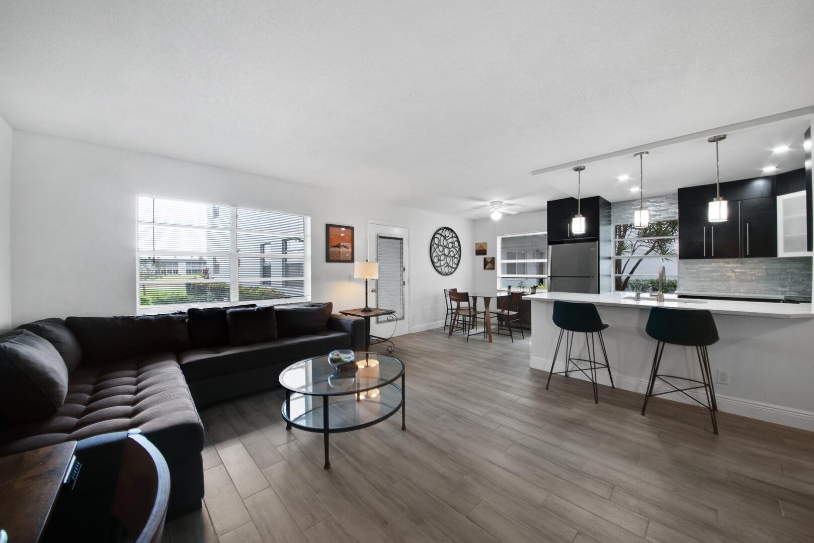 21 Normandy A Delray Beach, FL 33484 - Photo 16 of 32 living room/kitchen/dining