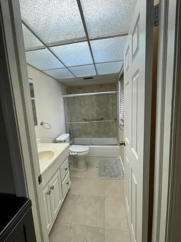 a bedroom with a bed and a closet