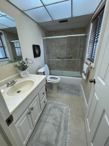 a balcony with furniture and a yard