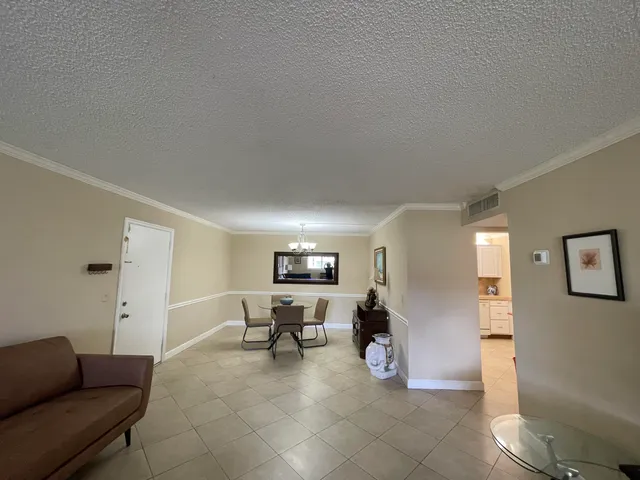 a kitchen with a sink appliances and cabinets