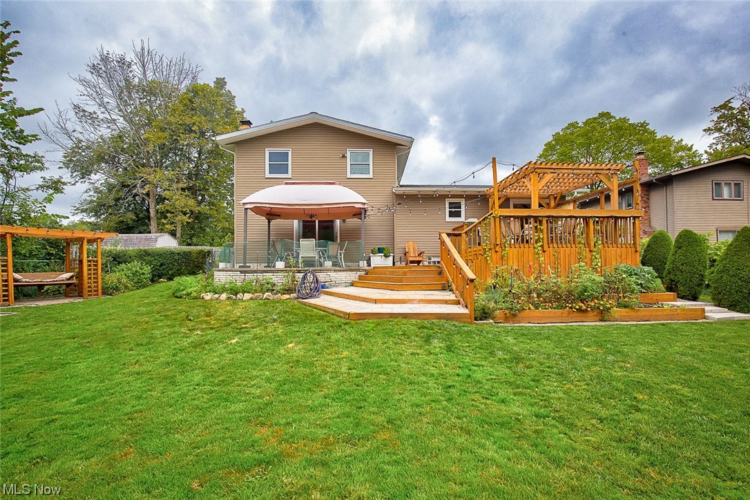 31950 Cannon Road Solon, OH 44139 - Photo 28 of 33 Rear view of property with a yard, a deck, and a pergola
