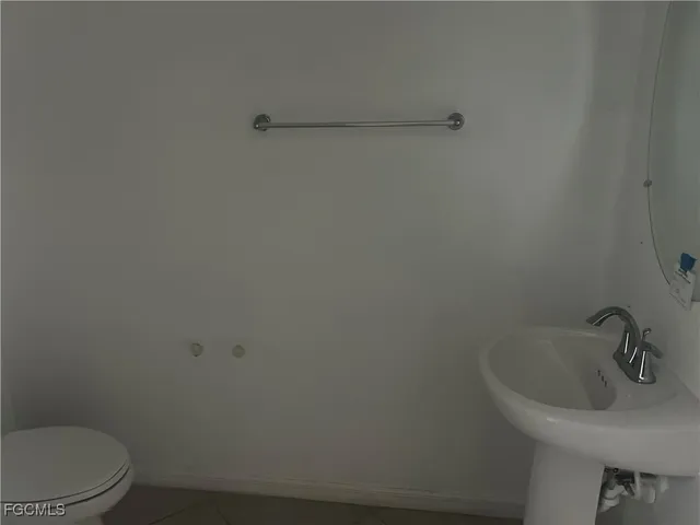 a bathroom with a sink and a toilet