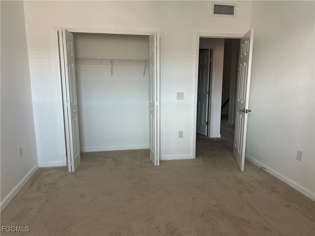 10132 Via Colomba Circle Fort Myers, FL 33966 - Photo 8 of 15 an empty room that has a grey walls