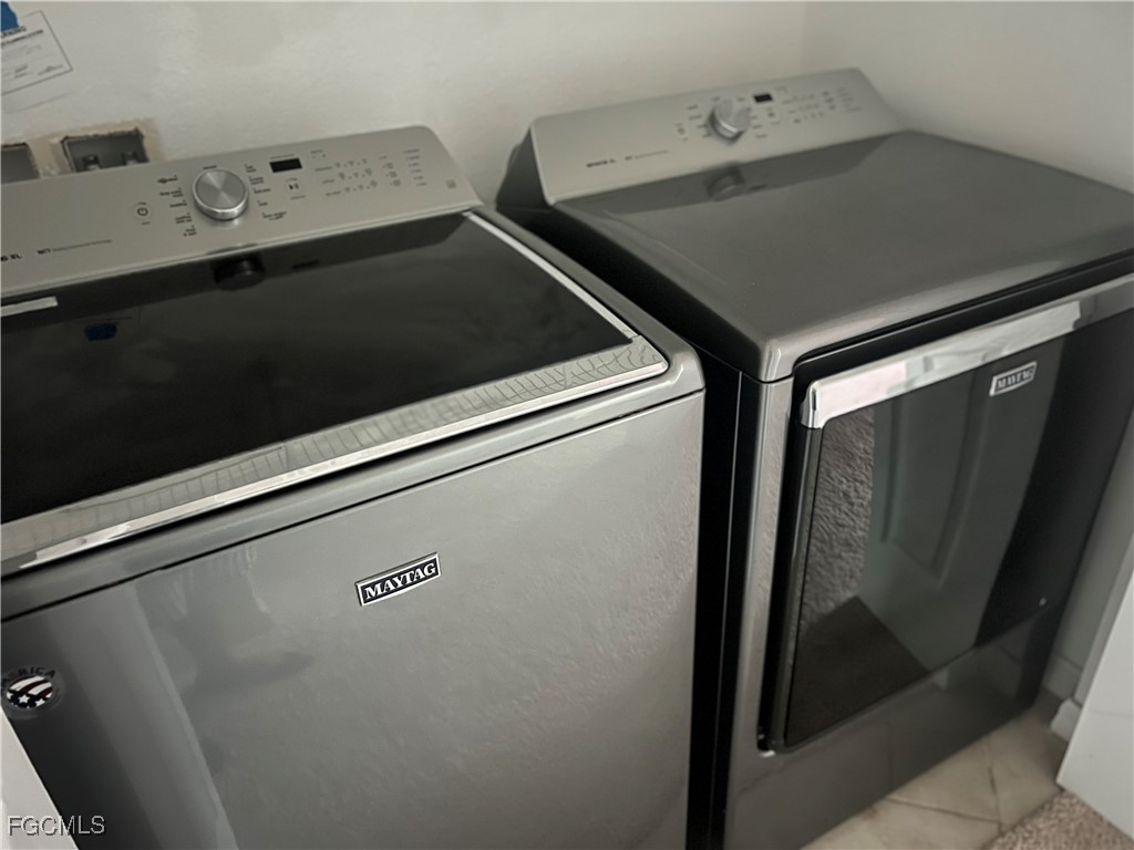 10132 Via Colomba Circle Fort Myers, FL 33966 - Photo 10 of 15 a utility room with dryer and washer