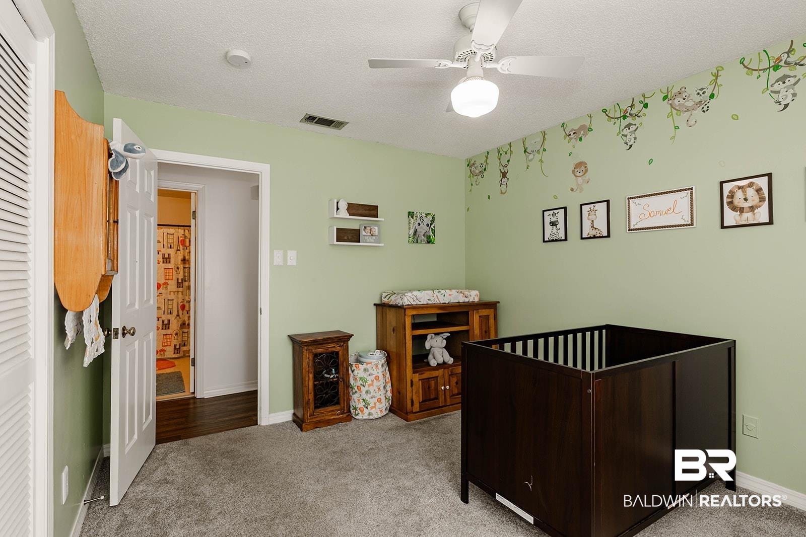 2920 Quail Creek Run Mobile, AL 36695 - Photo 24 of 33 Bedroom featuring carpet, ceiling fan, a nursery area, and a textured ceiling