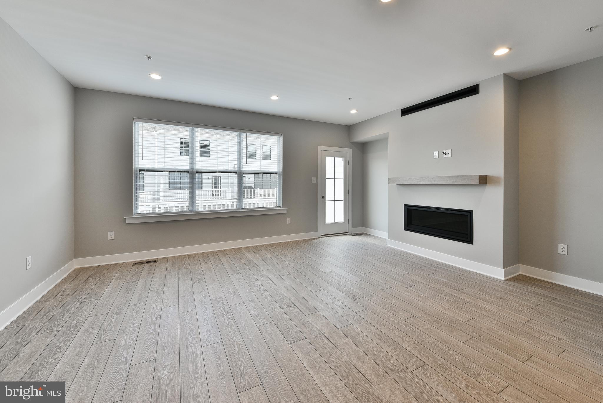 328 Walnut Street Collegeville, PA 19426 - Photo 11 of 35 an empty room with wooden floor and windows