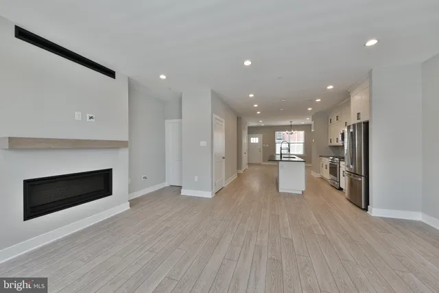 a bathroom with a sink toilet and a mirror