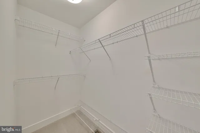 a bathroom with a double vanity sink and mirror