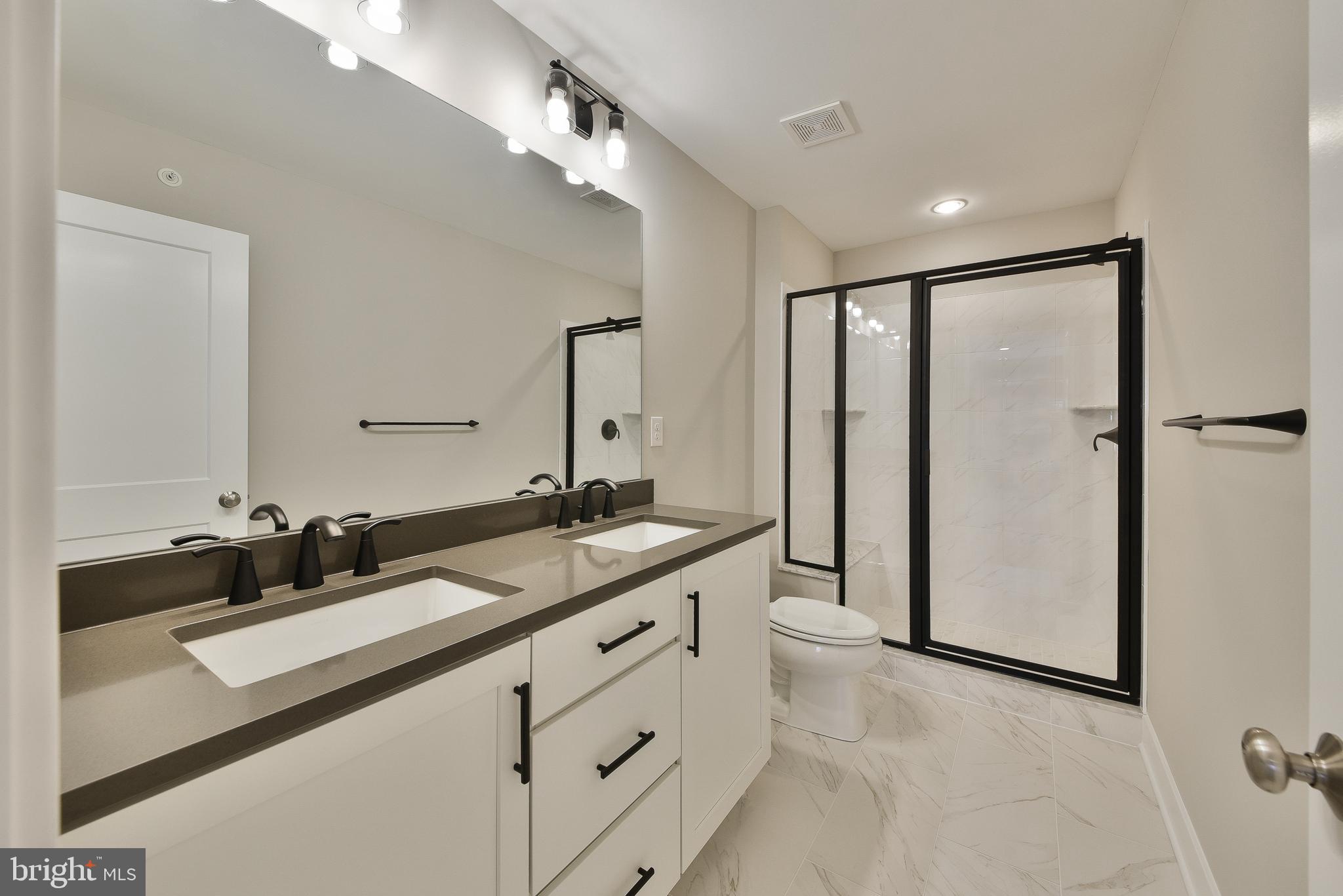 328 Walnut Street Collegeville, PA 19426 - Photo 20 of 35 a bathroom with a double vanity sink and mirror