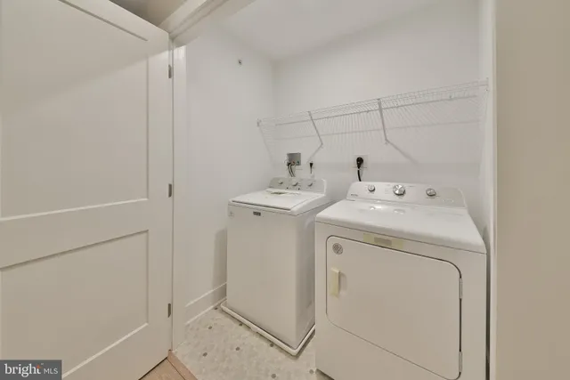 a view of hallway with a white wall