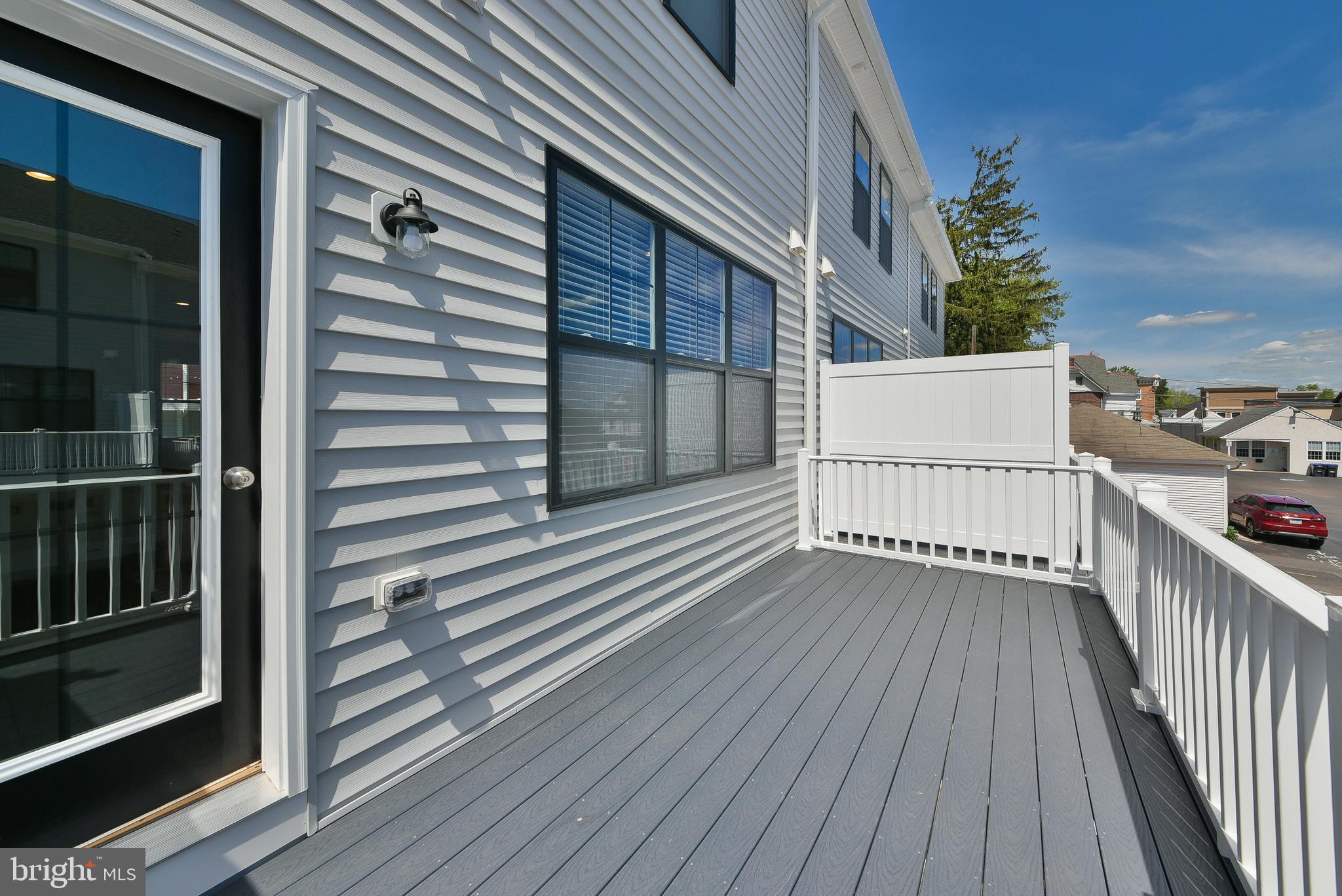 328 Walnut Street Collegeville, PA 19426 - Photo 34 of 35 a view of a wooden deck and a yard