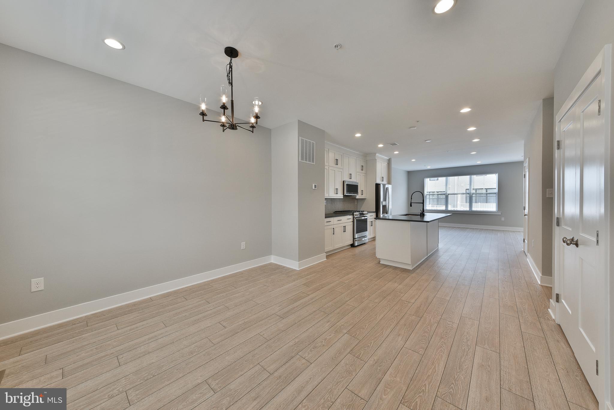 328 Walnut Street Collegeville, PA 19426 - Photo 5 of 35 a view of a kitchen with wooden floor and a sink