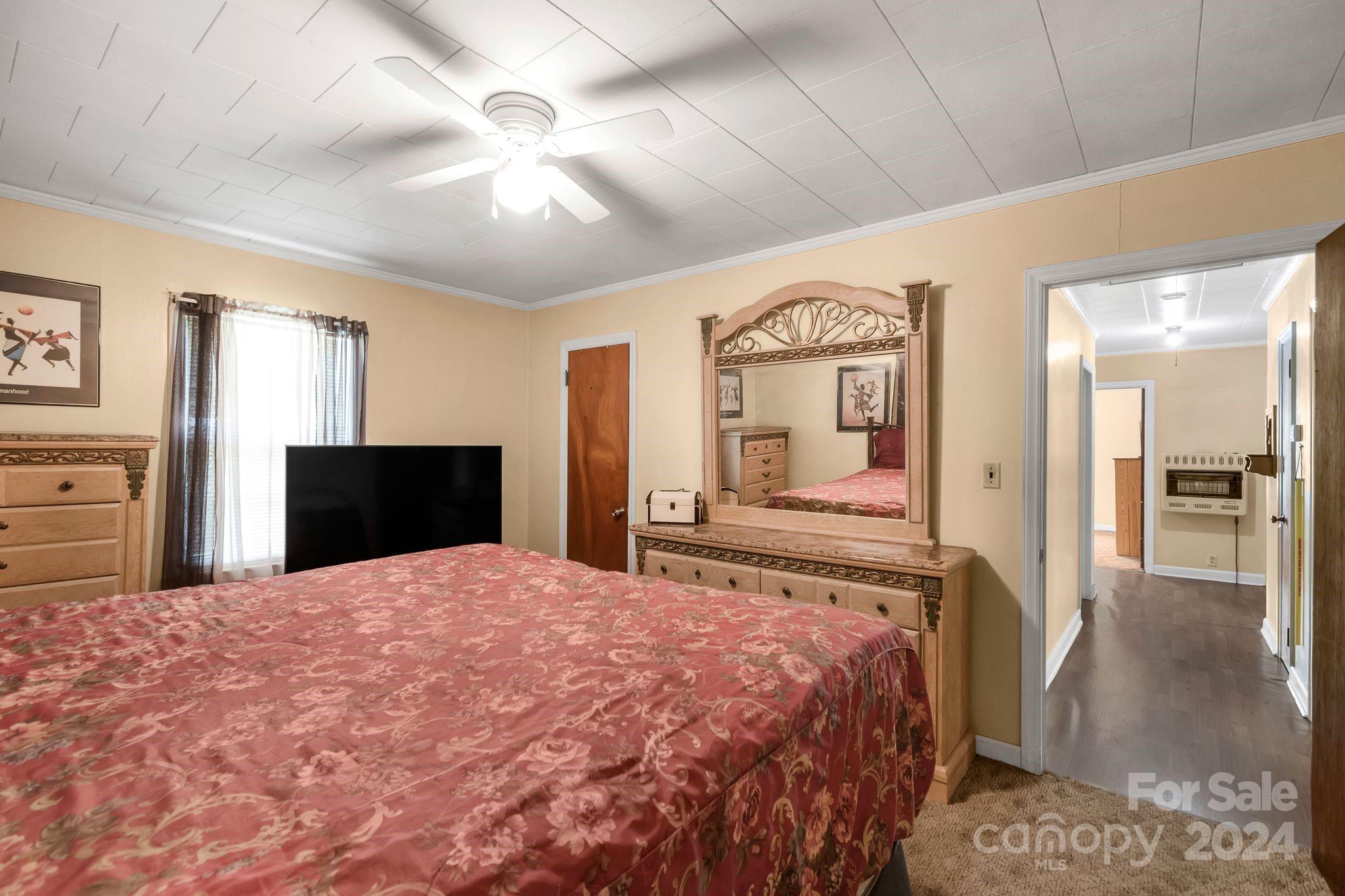 1209 White Store Road Wadesboro, NC 28170 - Photo 20 of 30 a bedroom with a bed and a walk in closet