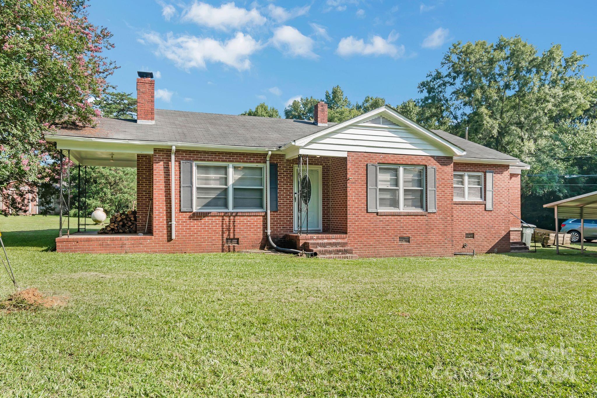 1209 White Store Road Wadesboro, NC 28170 - Photo 3 of 30 a view of a house with a yard and sitting area