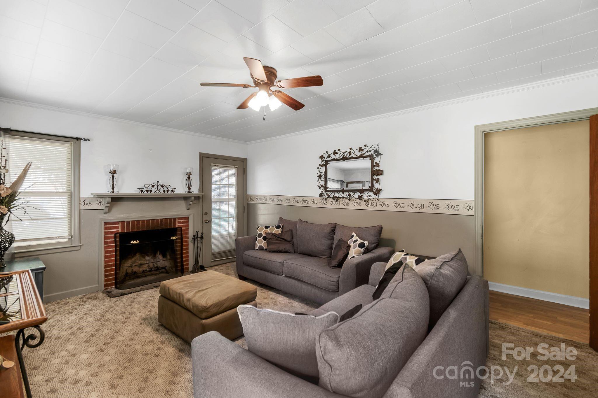 1209 White Store Road Wadesboro, NC 28170 - Photo 7 of 30 a living room with furniture and a fireplace