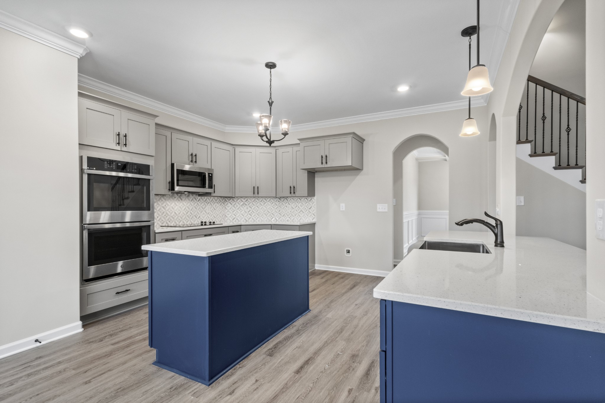 1173 Juniper Pass Clarksville, TN 37043 - Photo 13 of 51 a kitchen with stainless steel appliances kitchen island a sink cabinets and wooden floor