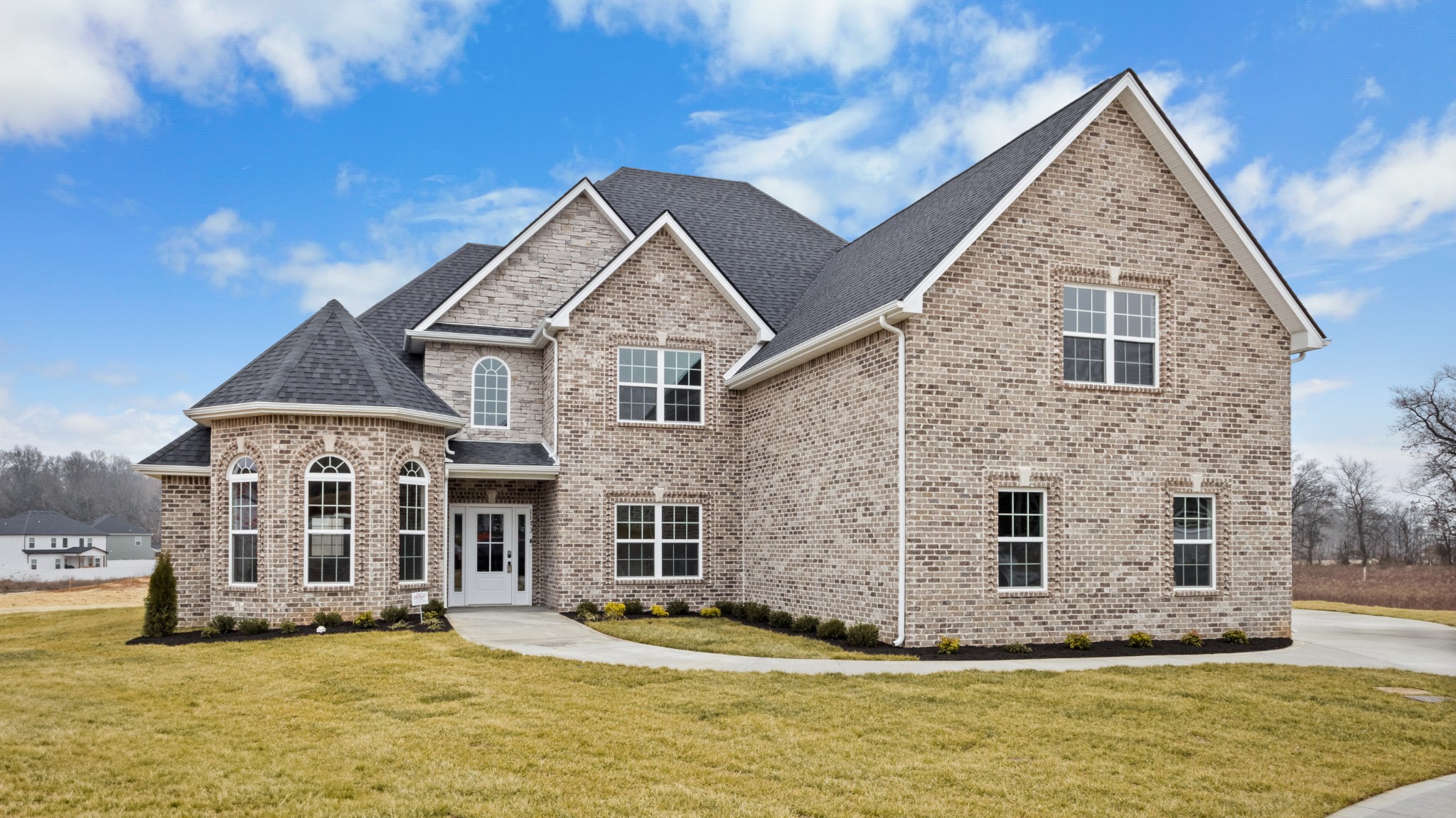 1173 Juniper Pass Clarksville, TN 37043 - Photo 3 of 51 a view of a brick house with a yard