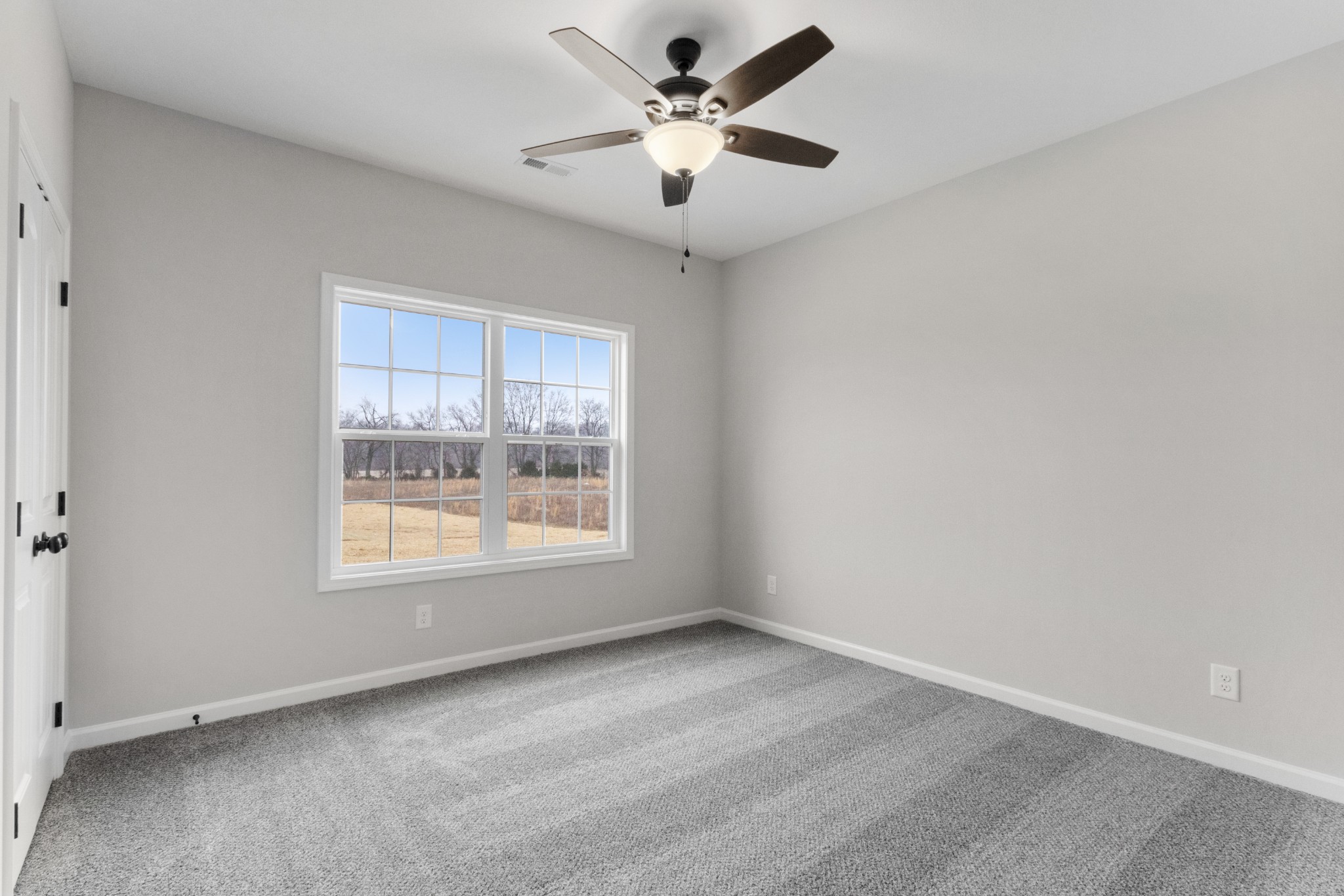 1173 Juniper Pass Clarksville, TN 37043 - Photo 32 of 51 an empty room with a window and a fan