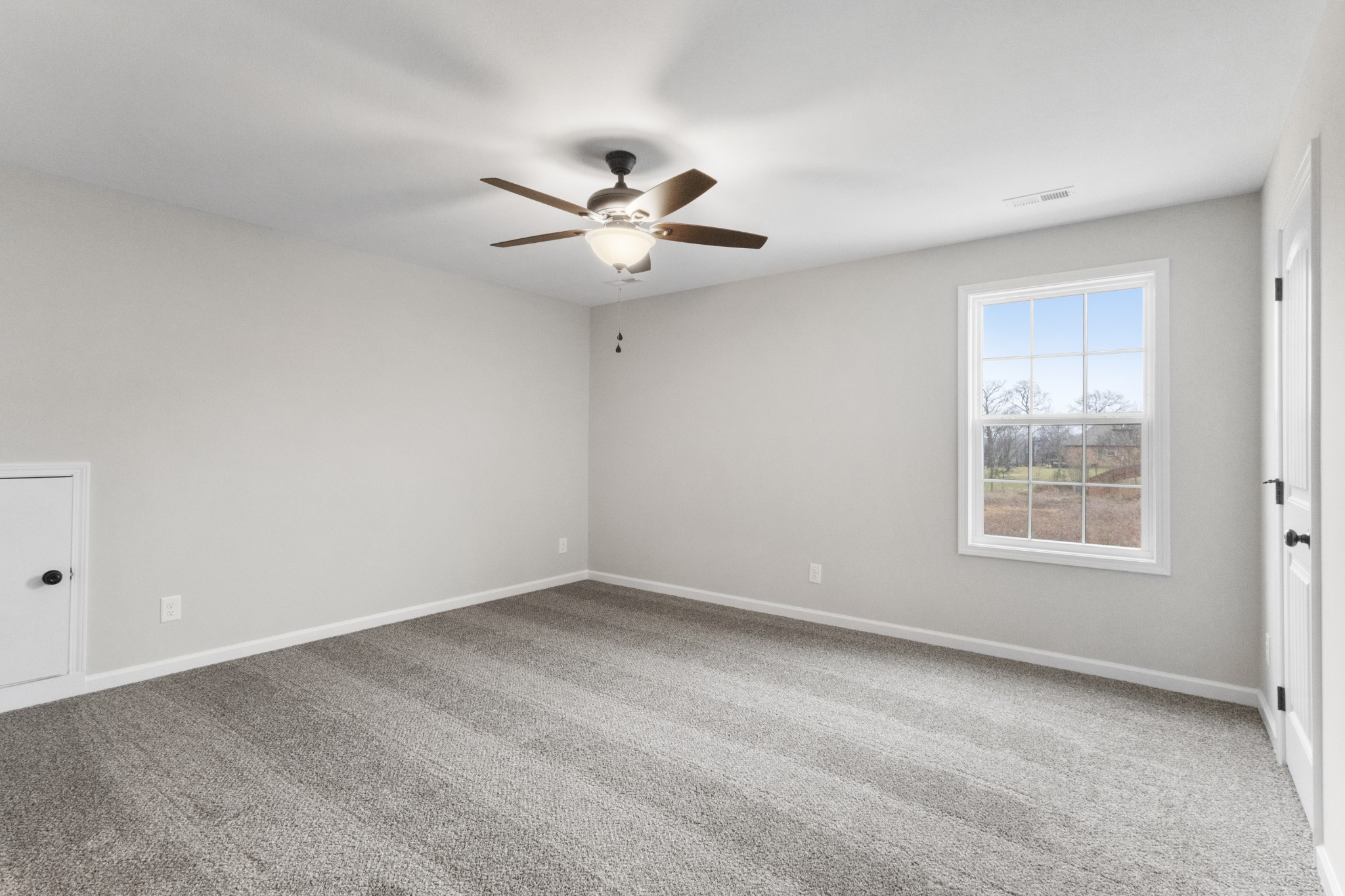 1173 Juniper Pass Clarksville, TN 37043 - Photo 37 of 51 an empty room with a window and a fan
