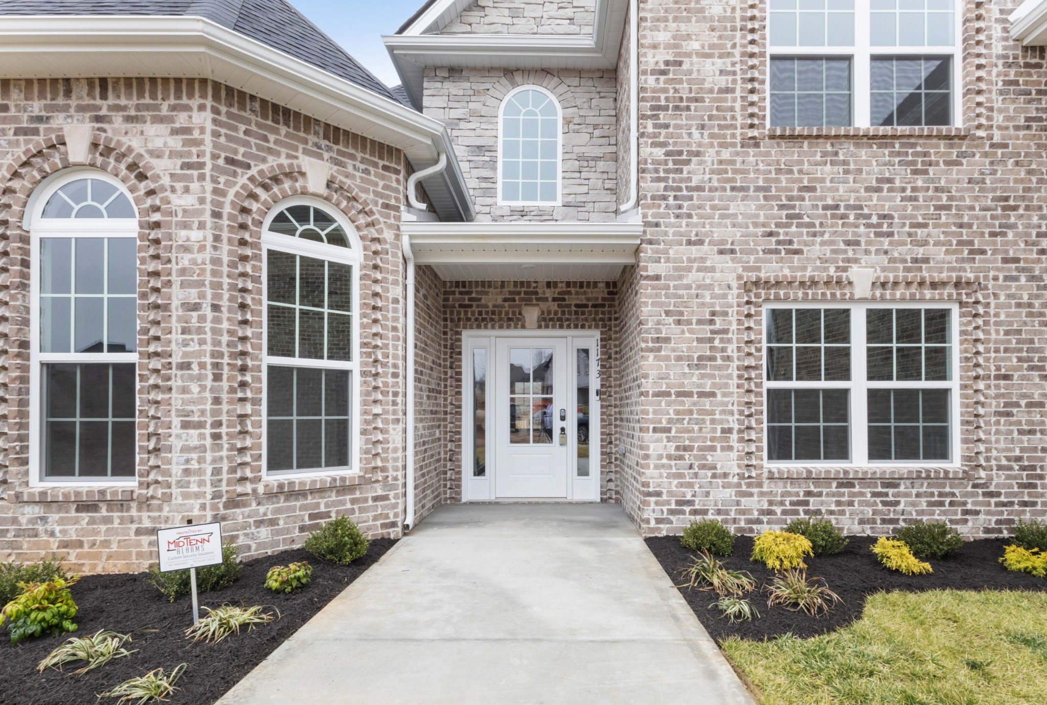 1173 Juniper Pass Clarksville, TN 37043 - Photo 7 of 51 a front view of a house with large windows