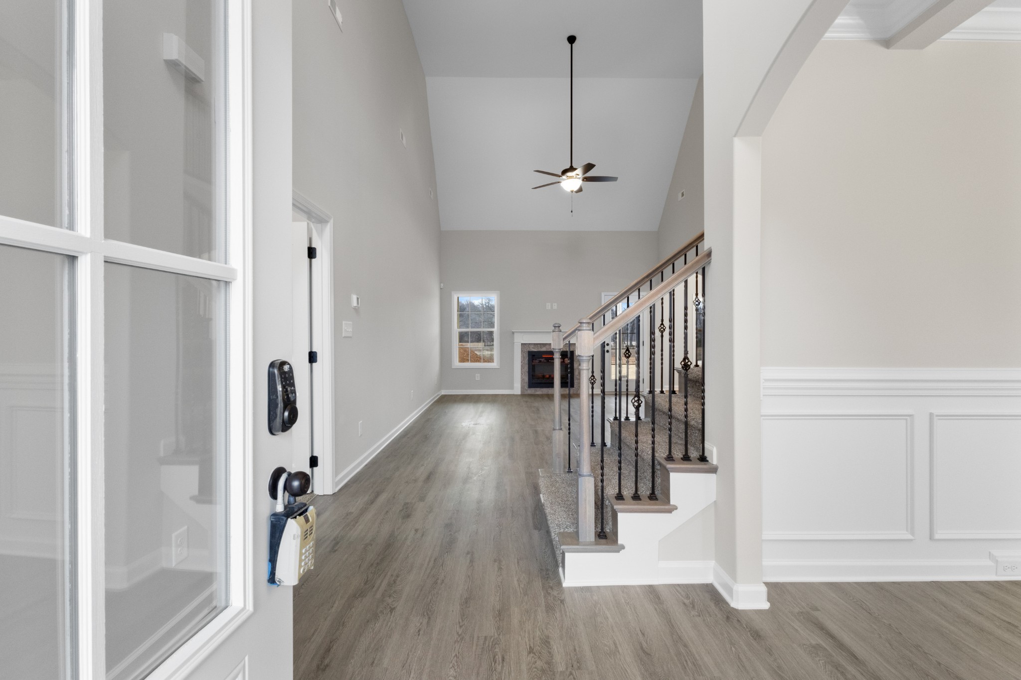 1173 Juniper Pass Clarksville, TN 37043 - Photo 8 of 51 a view of a hallway with wooden floor and staircase