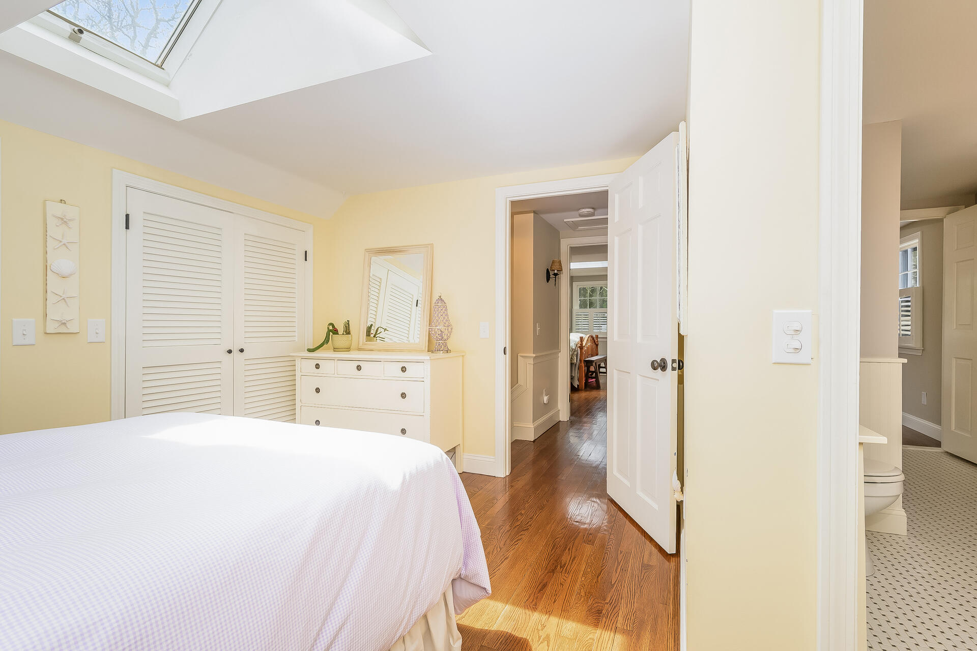 44 Cedarwood Road Cotuit, MA 02635 - Photo 14 of 19 a spacious bedroom with a bed and a cabinets