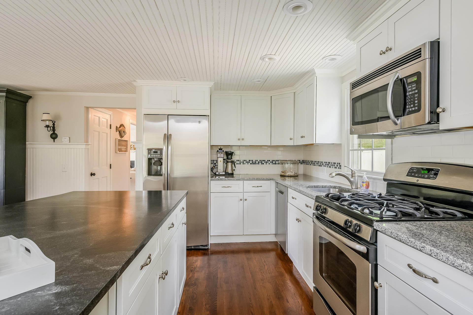 44 Cedarwood Road Cotuit, MA 02635 - Photo 3 of 19 a kitchen with stainless steel appliances granite countertop a stove a sink and a microwave