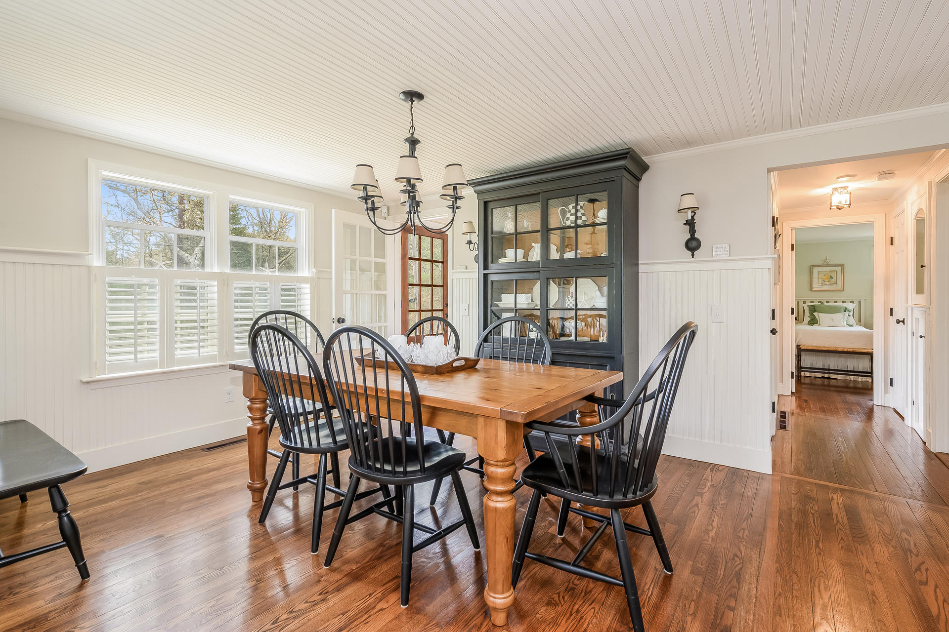 44 Cedarwood Road Cotuit, MA 02635 - Photo 4 of 19 a view of a dining room with furniture wooden floor and chandelier