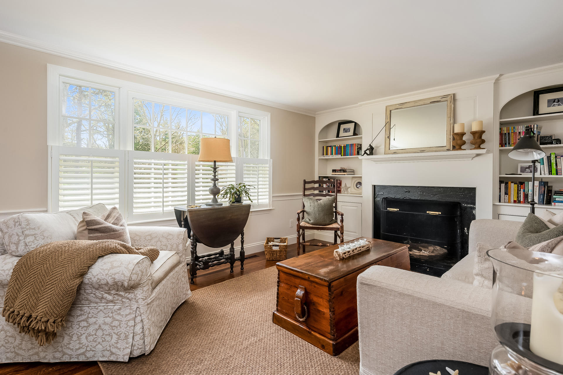 44 Cedarwood Road Cotuit, MA 02635 - Photo 9 of 19 a living room with furniture and a fireplace