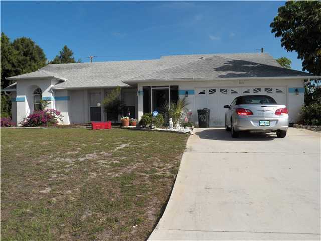 a view of a car park in front of house