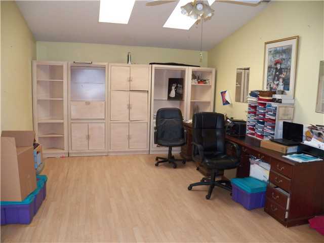 780 Southwest Ancona Road Port St. Lucie, FL 34953 - Photo 3 of 7 a view of a workspace with furniture