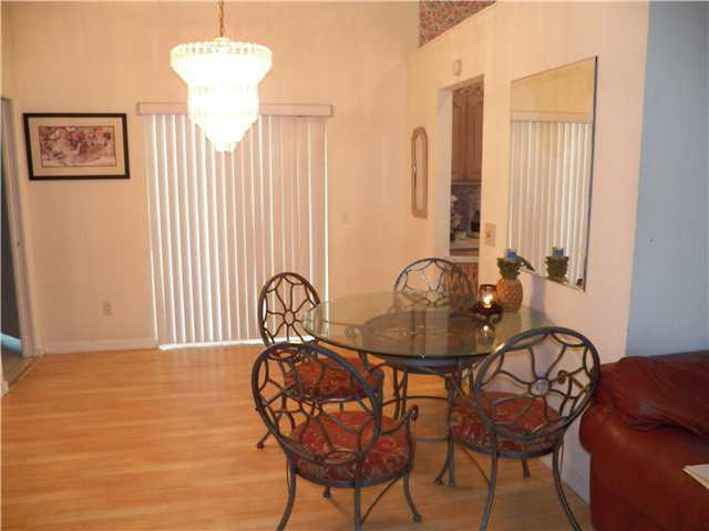 780 Southwest Ancona Road Port St. Lucie, FL 34953 - Photo 5 of 7 a table and chairs in a room
