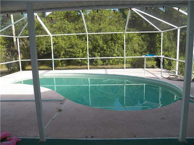 780 Southwest Ancona Road Port St. Lucie, FL 34953 - Photo 6 of 7 a view of a backyard