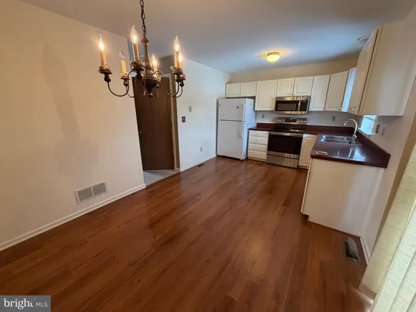 a view of a kitchen with a sink