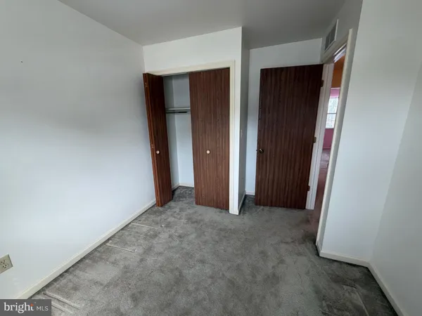 an empty room with closet