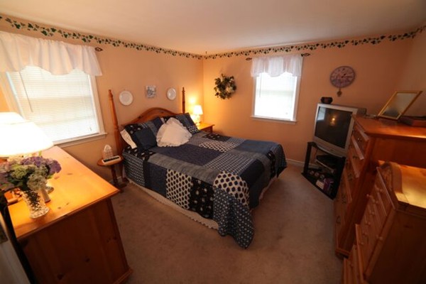 99 Spallus Road Stoughton, MA 02072 - Photo 7 of 14 a bedroom with furniture and a window