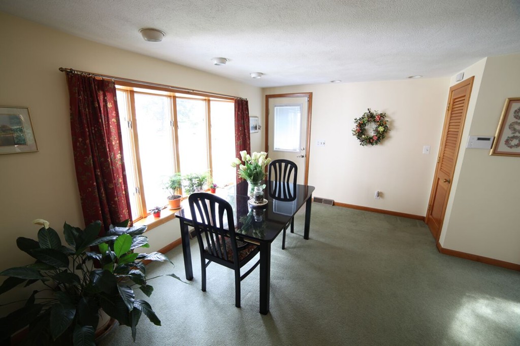 99 Spallus Road Stoughton, MA 02072 - Photo 10 of 14 a view of a livingroom with furniture and a window